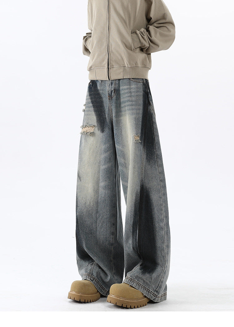 Bending knife deconstruction spray painting to make old jeans
