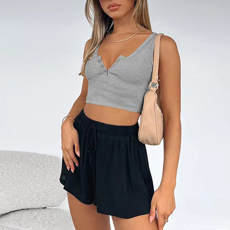 Women's short crop cut slim fit sleeveless top with exposed navel