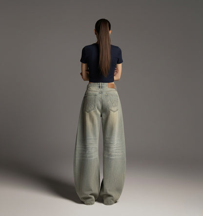 Vintage distressed dirty dyed curved knife jeans