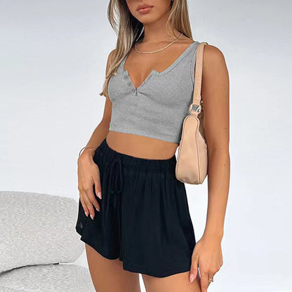 Women's short crop cut slim fit sleeveless top with exposed navel