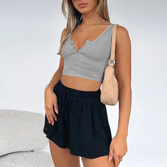 Women's short crop cut slim fit sleeveless top with exposed navel
